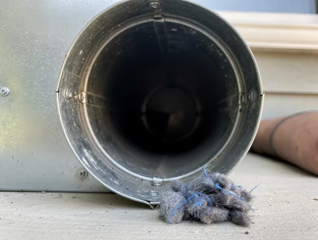 East Lyme Dryer Vent Cleaning technician using specialized equipment to clear severe dryer vent blockage in East Lyme